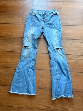 Light Blue Distressed Flare Jeans - Women's